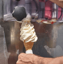 Vanilla ice cream cone and soft serve machine