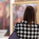 Woman visiting excursion in museum