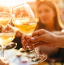 clinking glasses with wine