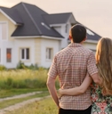 Couple looking at their new house