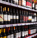Shelves with wine at beverage section of supermarket