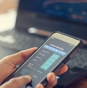 Businessman using online banking services on smartphone