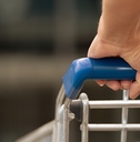 Man driving shopping cart
