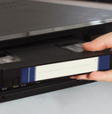 Inserting VHS tape into player 