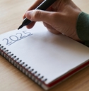 Hand writing 2025 New Year&#x27;s resolution concept