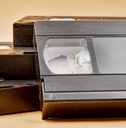 Vintage videotapes on beige background