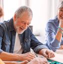 Senior people playing board games
