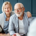 Senior couple signing agreement with finance advisor