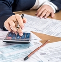 Woman filling US 1040 tax form