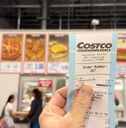 hand Holding receipt at costco food court