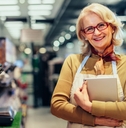 Owner standing in a grocery store