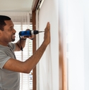 Man using electric drill