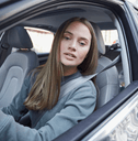 young driver backing car up