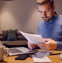 a casual businessman doing paperwork