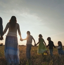 Family walking on the floor at sunset