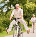 happy senior couple riding bicycles
