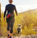 woman hiking with dog