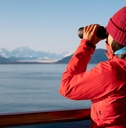 passenger looking at Alaskan mountains
