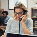 businesswoman talking on phone at office 