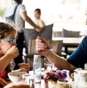 Guests having breakfast at hotel restaurant