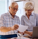 senior couple planning their household budget