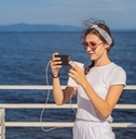 Woman using mobile phone on vacation