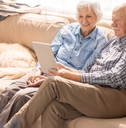 portrait of modern senior couple using laptop