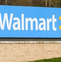 walmart roadside store sign in daylight green grass