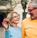 senior couple holding keys