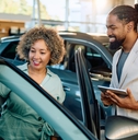 woman buying new car