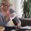 retired woman working on a computer