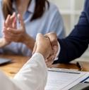 managers and job applicants shake hands