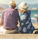 retired lovers enjoying retirement on the beach