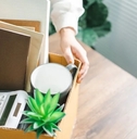 Woman packing up belongings at work