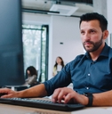 man in shirt working