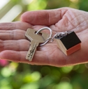 woman showing new house keys 