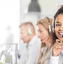 Call center worker accompanied by her team