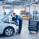 mechanics working on car