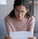 woman in glasses frustrated and confused