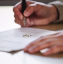 Ring, hands and divorce papers for signature