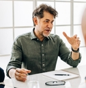 man having a discussion with his team