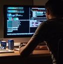 programmer sitting and writing code