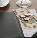 bill with american dollars on table