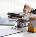 real estate agent holding a calculator