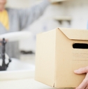 man carrying heavy carton box