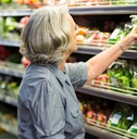 senior woman picking out some vegetables