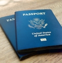 american passports laying on a wooden desk