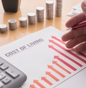 paper showing a graph of the rising cost of living 