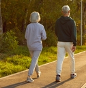 Senior active couple, old spouses enjoy walking outdoor