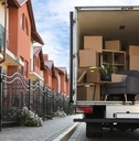 van full of moving boxes and furniture
